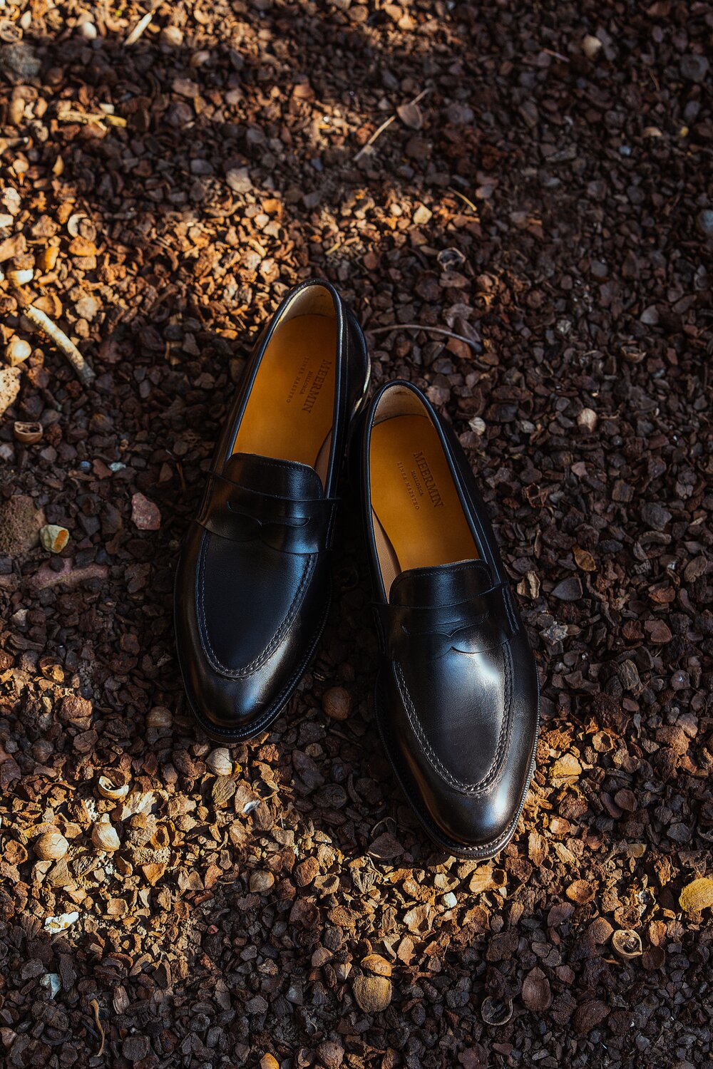 A pair of black calf loafers.