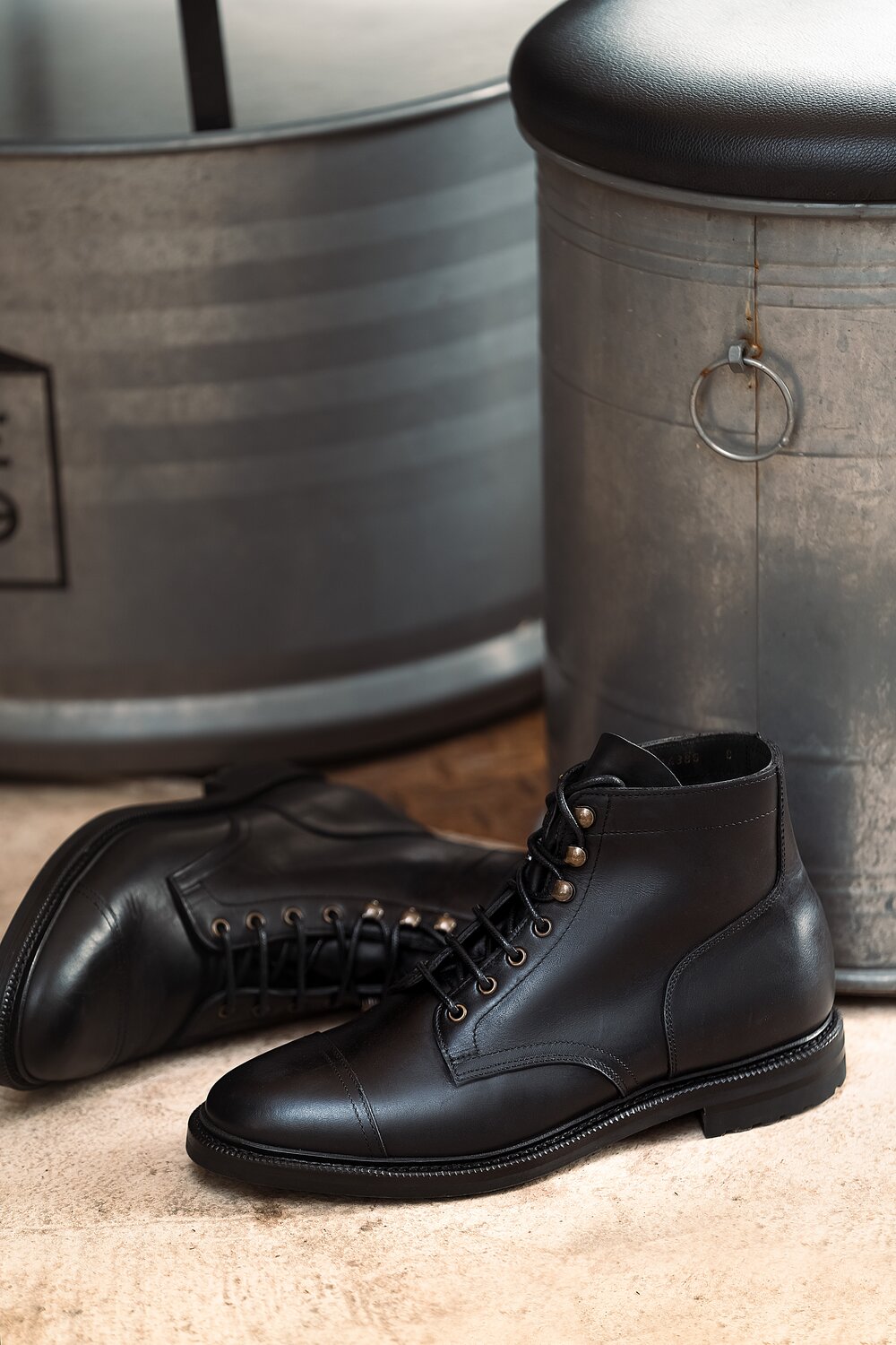 Pair of workboots in black waxy calf leather.