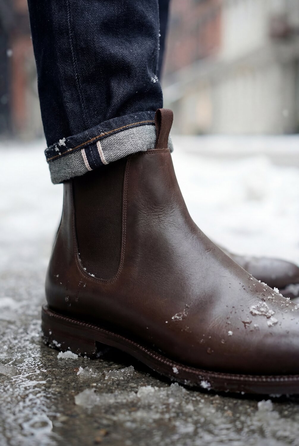 A pair of waxed chelsea boots