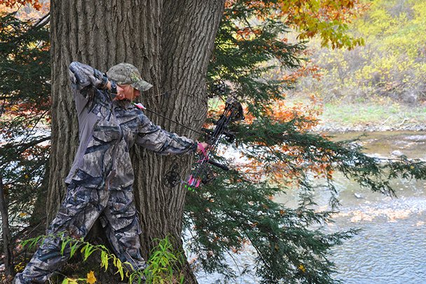 Female Hunter With Her Bow Pulled Back