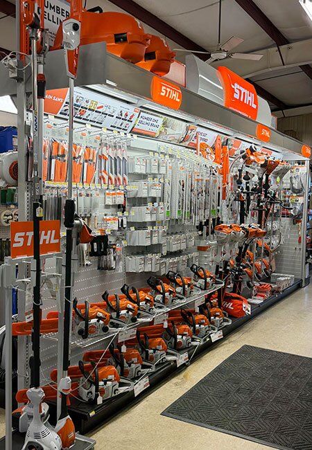 A fully stocked aisle and displays of STIHL products at Mahuron's Building Supply.