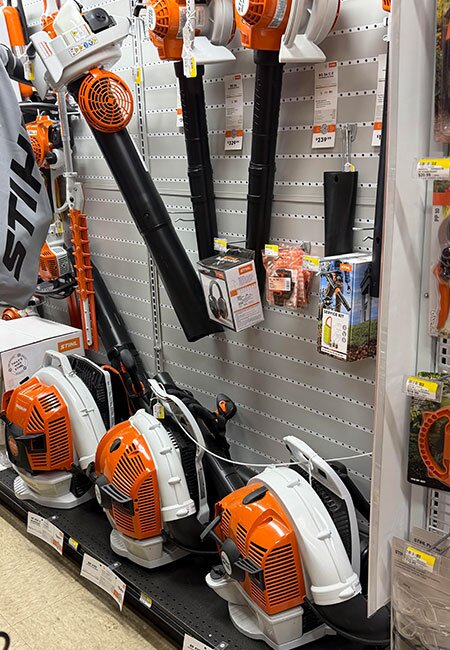 A fully stocked aisle and displays of STIHL products at Mahuron's Building Supply.