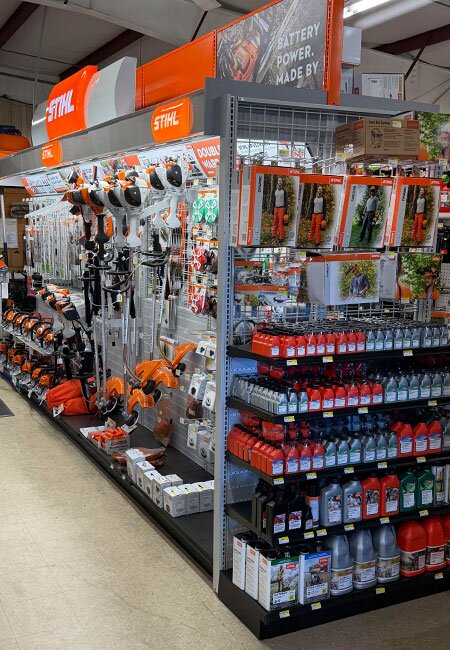 A fully stocked aisle and displays of STIHL products at Mahuron's Building Supply.