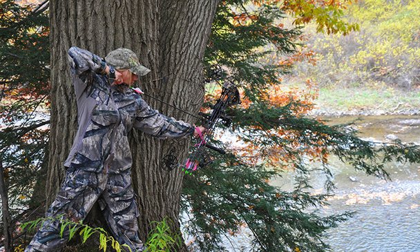 Female Hunter With Her Bow PulledBack