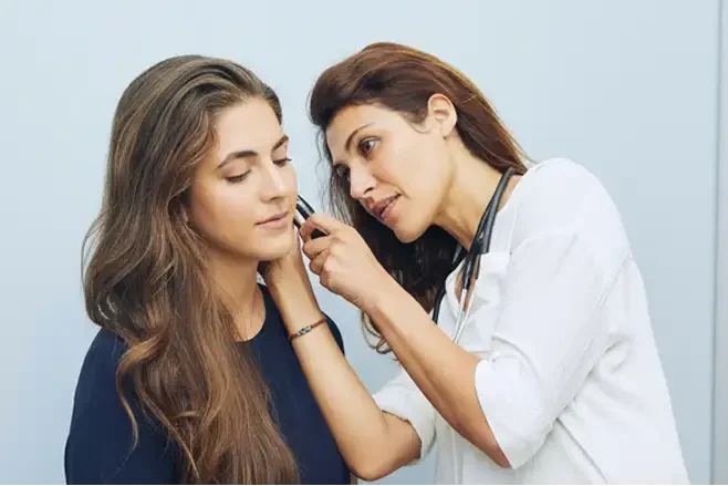 Doctor examining a patient