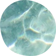 Closeup of sun hitting calm water