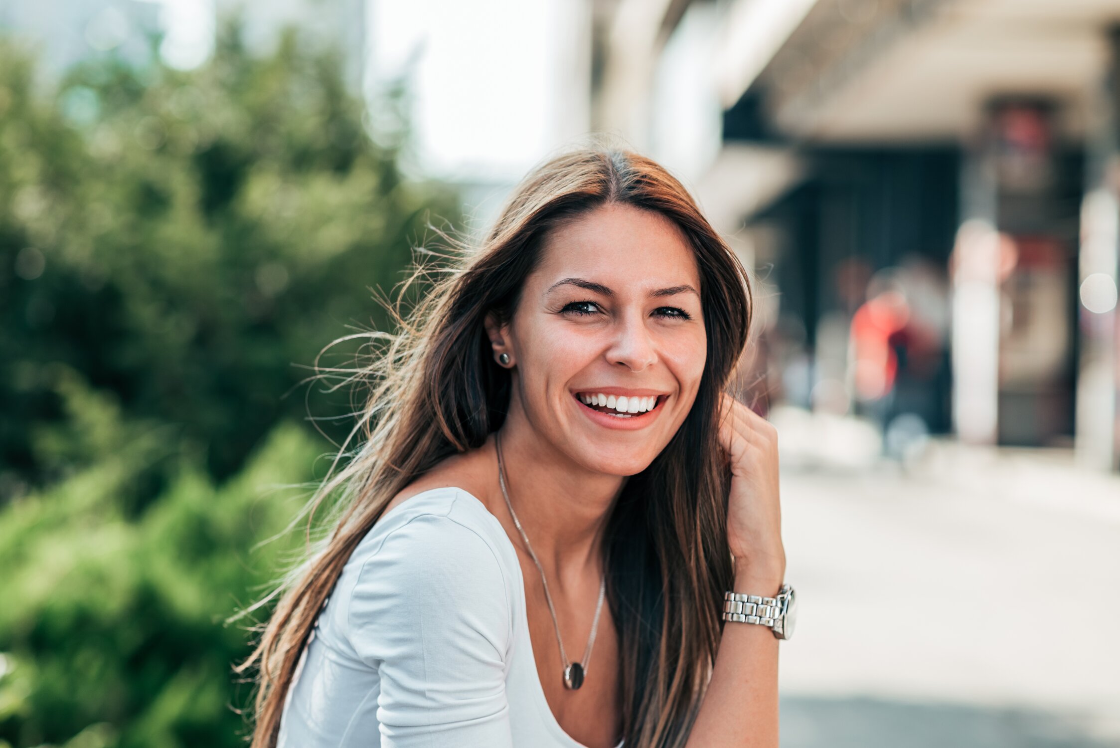 Smiling woman outside in park