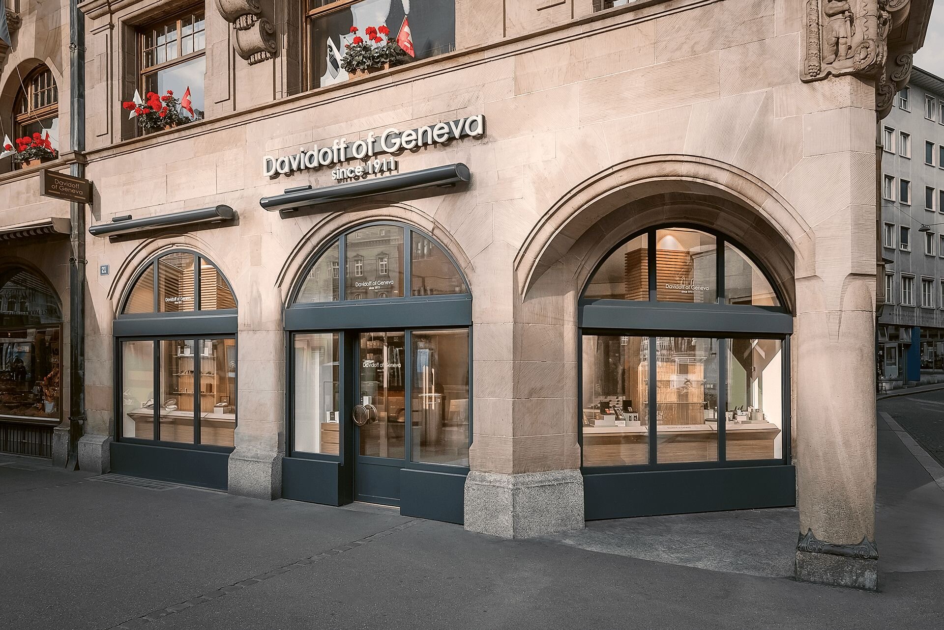 An image of the entrance to the flagship store in Basel, Switzerland, featuring the "Davidoff of Geneva since 1911" logo prominently above the entrance.