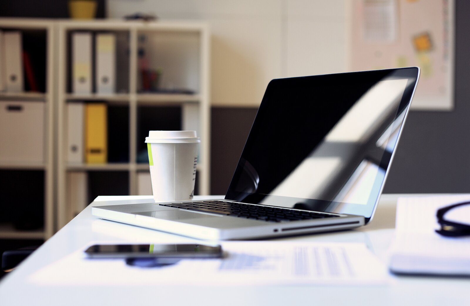  A laptop on a desk, ready for use in a modern working environment.