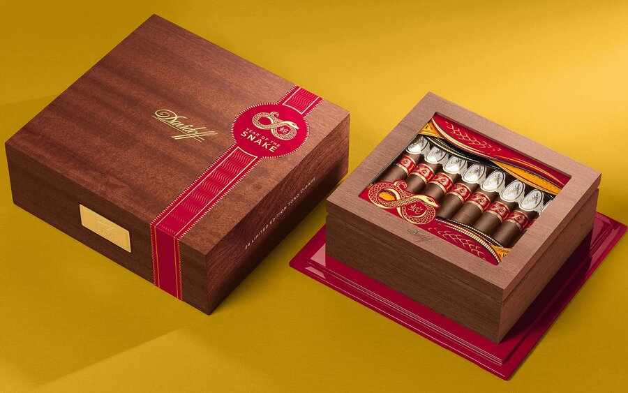 A close-up of two the exclusive cigar boxes from The Year Of The Snake 2025.