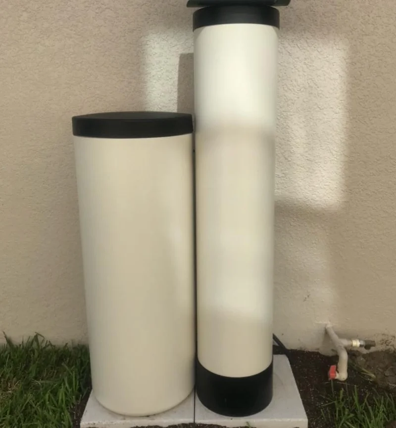 Whole-home water treatment equipment installed beside a Central Florida home