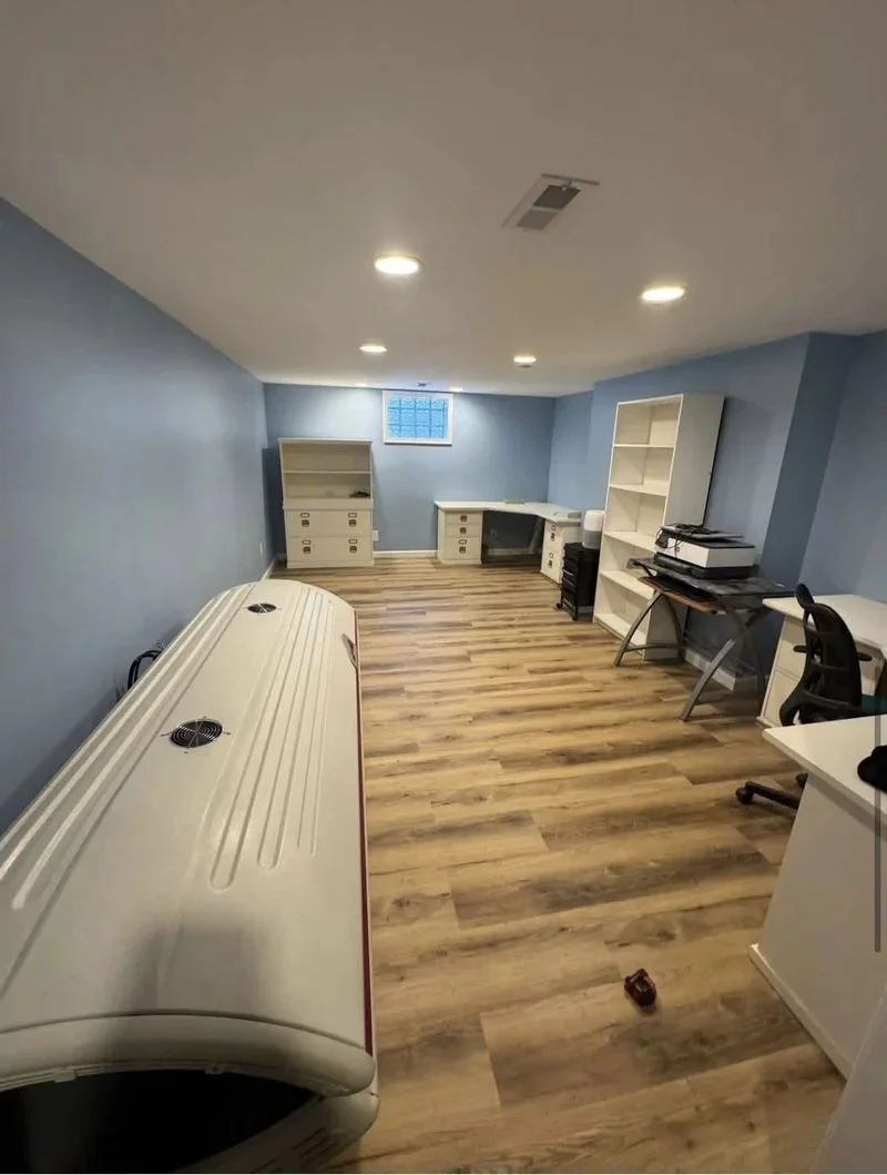 Finished basement with new flooring and walls