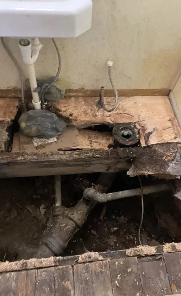 Bathroom floor before plumbing and repair work