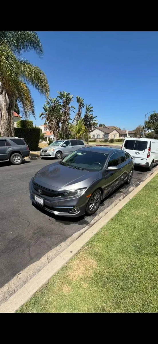 Clean gray Honda parked on a Los Angeles street