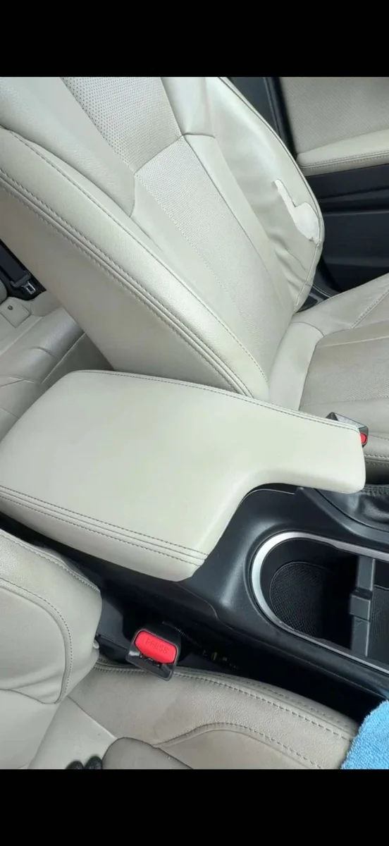 Clean light leather vehicle center console