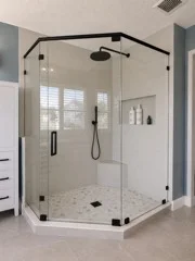 Neo-angle frameless glass shower enclosure with matte black hardware