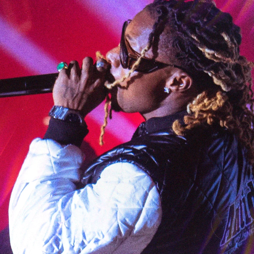 American rapper Young Thug performing on stage into a microphone
