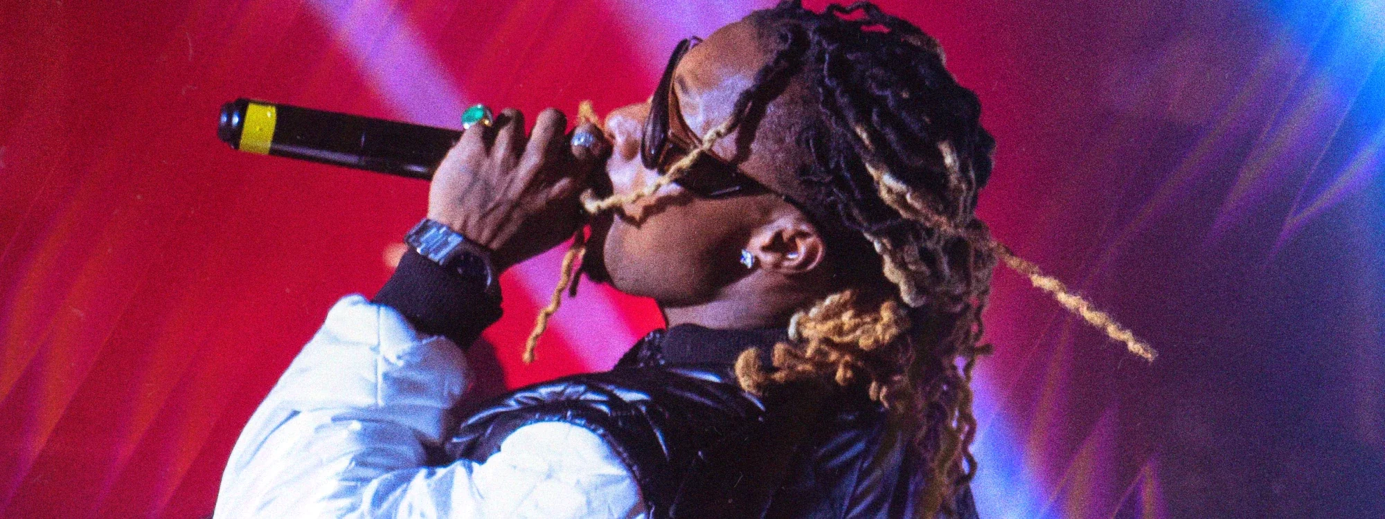American rapper Young Thug performing on stage into a microphone