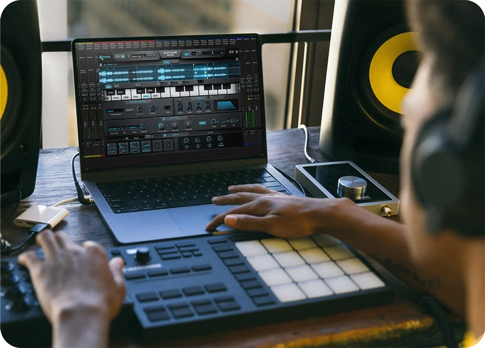 A male at a desk using Slice plugin by AutoTune