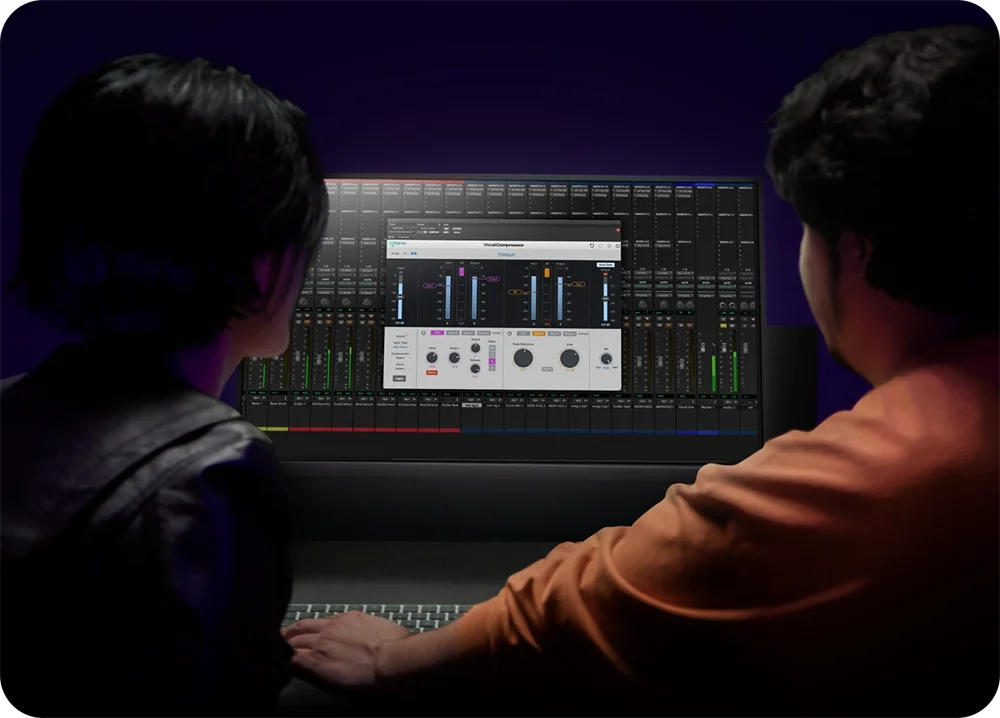 a female and male using vocal compressor on a computer