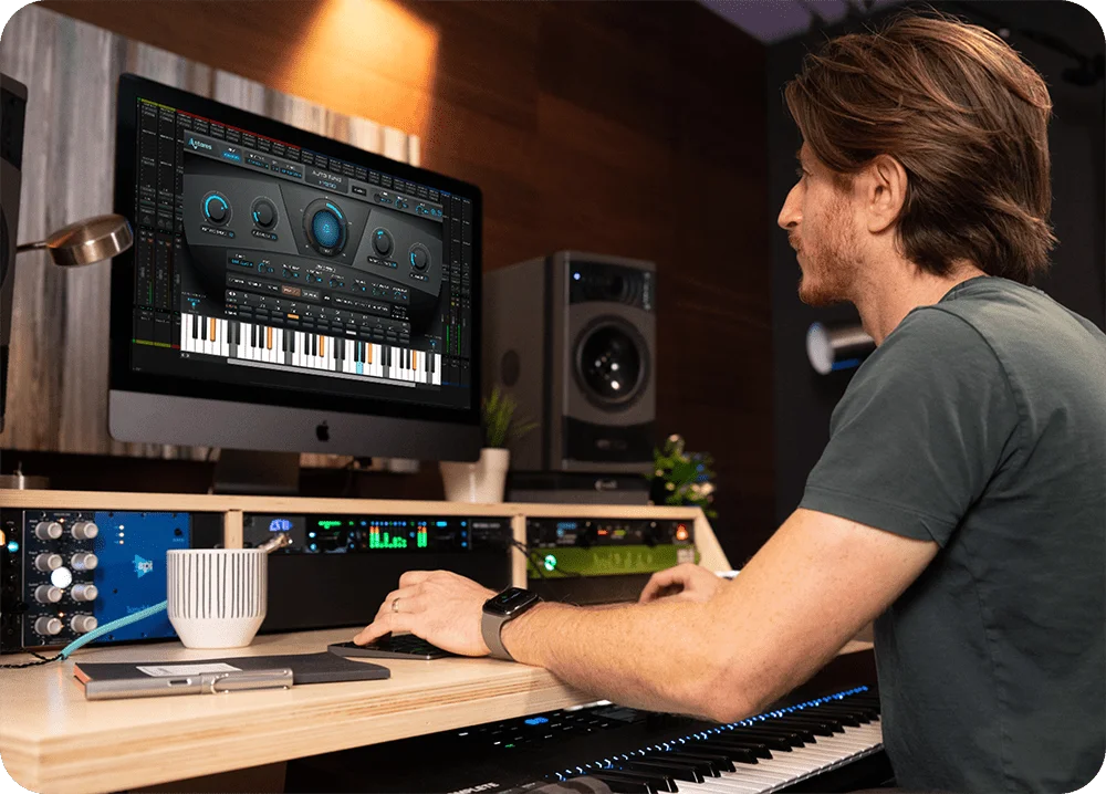 A man using AutoTune Hybrid in recording studio