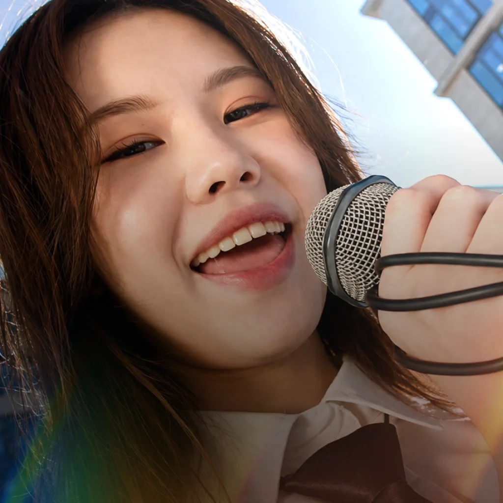 Close up of a woman singing into a microphone