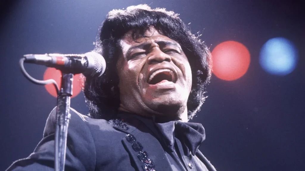 James Brown singing into a microphone