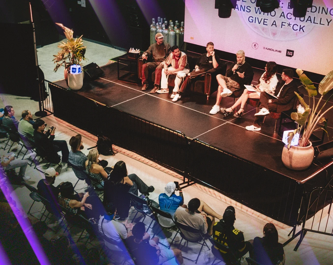 A panel of people talking in front of an audience