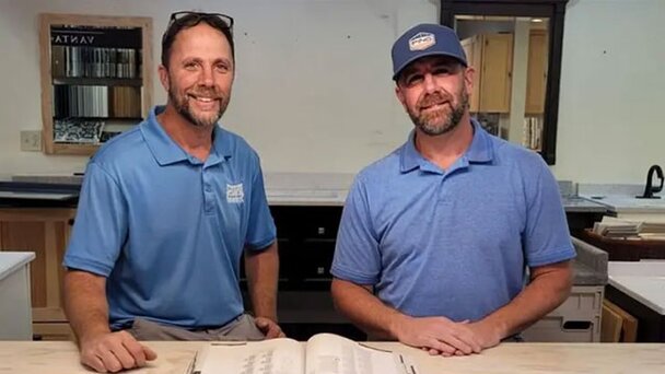Two staff from Tionestia Builders Supply. 