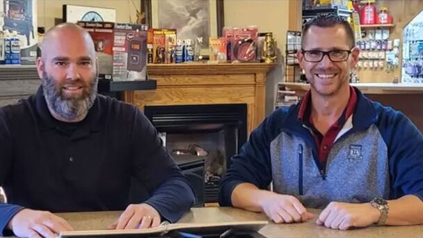 Two staff from Tionestia Builders Supply. 