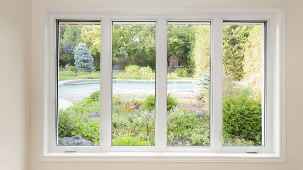 A window looking outside to a backyard.