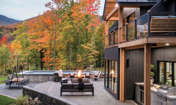 A beautiful home with a back deck in the fall season. 
