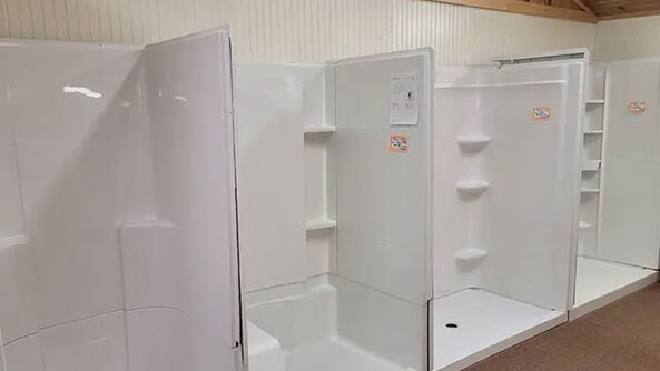 Tub surrounds in a showroom at Tionesta Builders Supply.