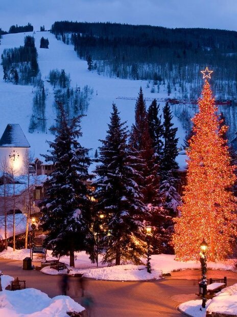 Pool area with blue lounge chairs with matching umbrellas