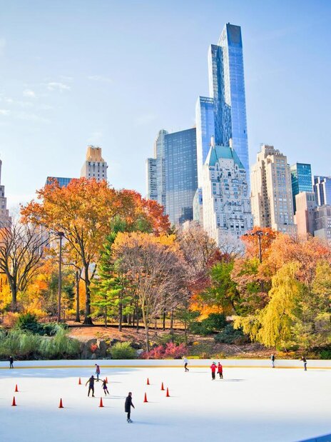 Pool area with blue lounge chairs with matching umbrellas