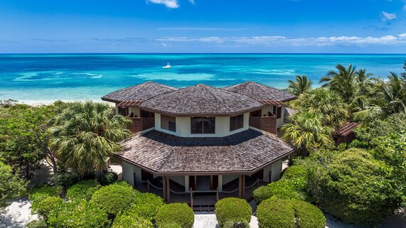 Aerial view of Caya Hico with the hexagon exterior and unobstructed view of of the ocean