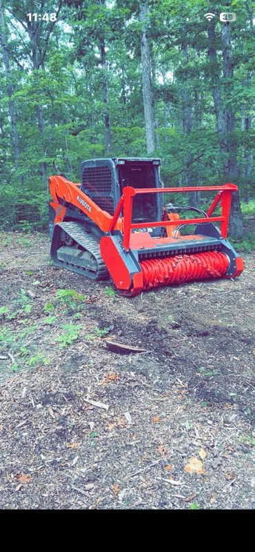 Forestry mulching machine clearing a wooded property in Middle Tennessee