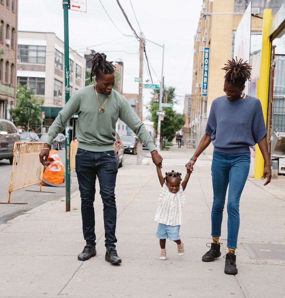 parents walking with their child
