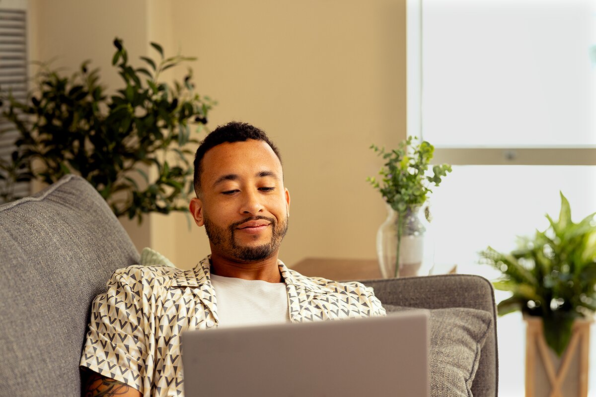 Man on couch with laptop