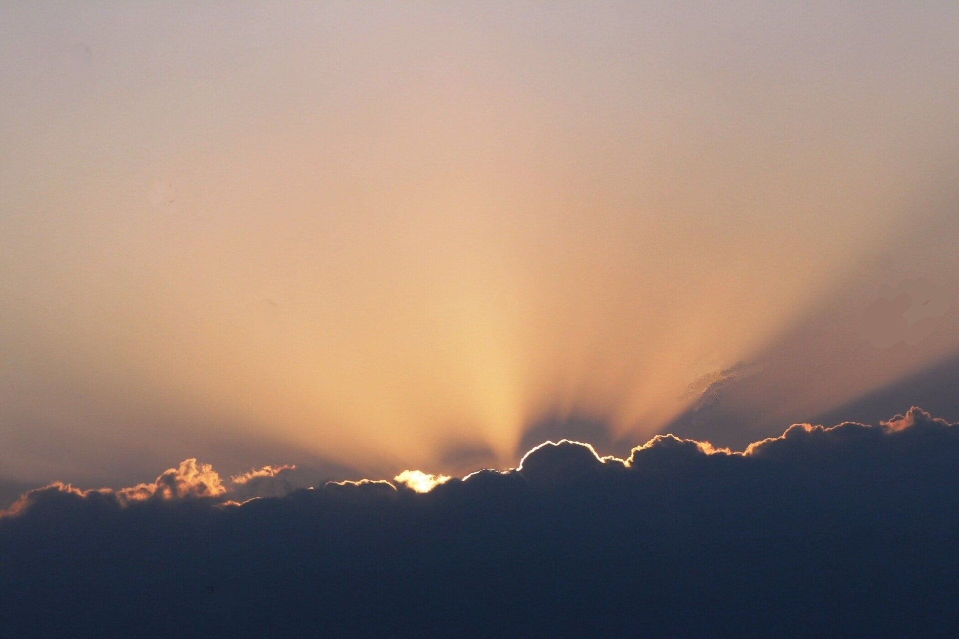 sun peaking through clouds