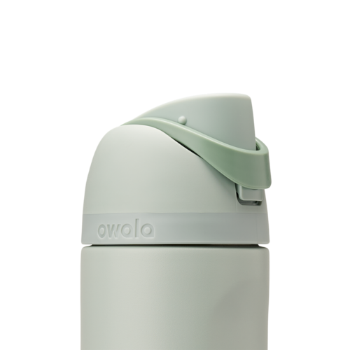 Owala FreeSip 24oz in Summer Paradise, lid detail showing pale sage flip cap with mint green carry loop arched upward and accent band