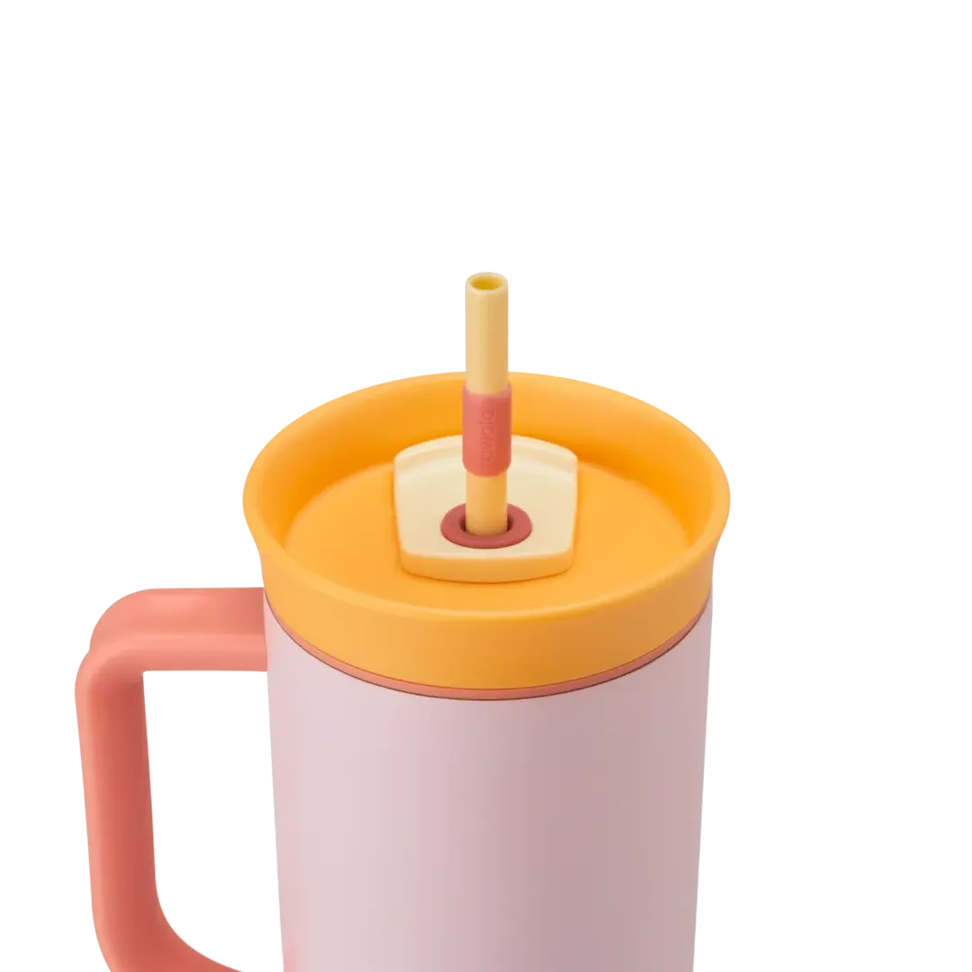 Owala Tumbler 40oz close-up in Candy Store, soft pink body with coral pink side handle, orange lid, and cream straw slider with yellow straw and coral grip