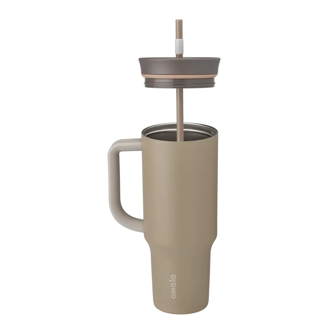 Owala Tumbler 40oz close-up in khaki tan, taupe body with matching tan side handle, mauve-taupe lid with copper accent ring, and tan straw with white grip
