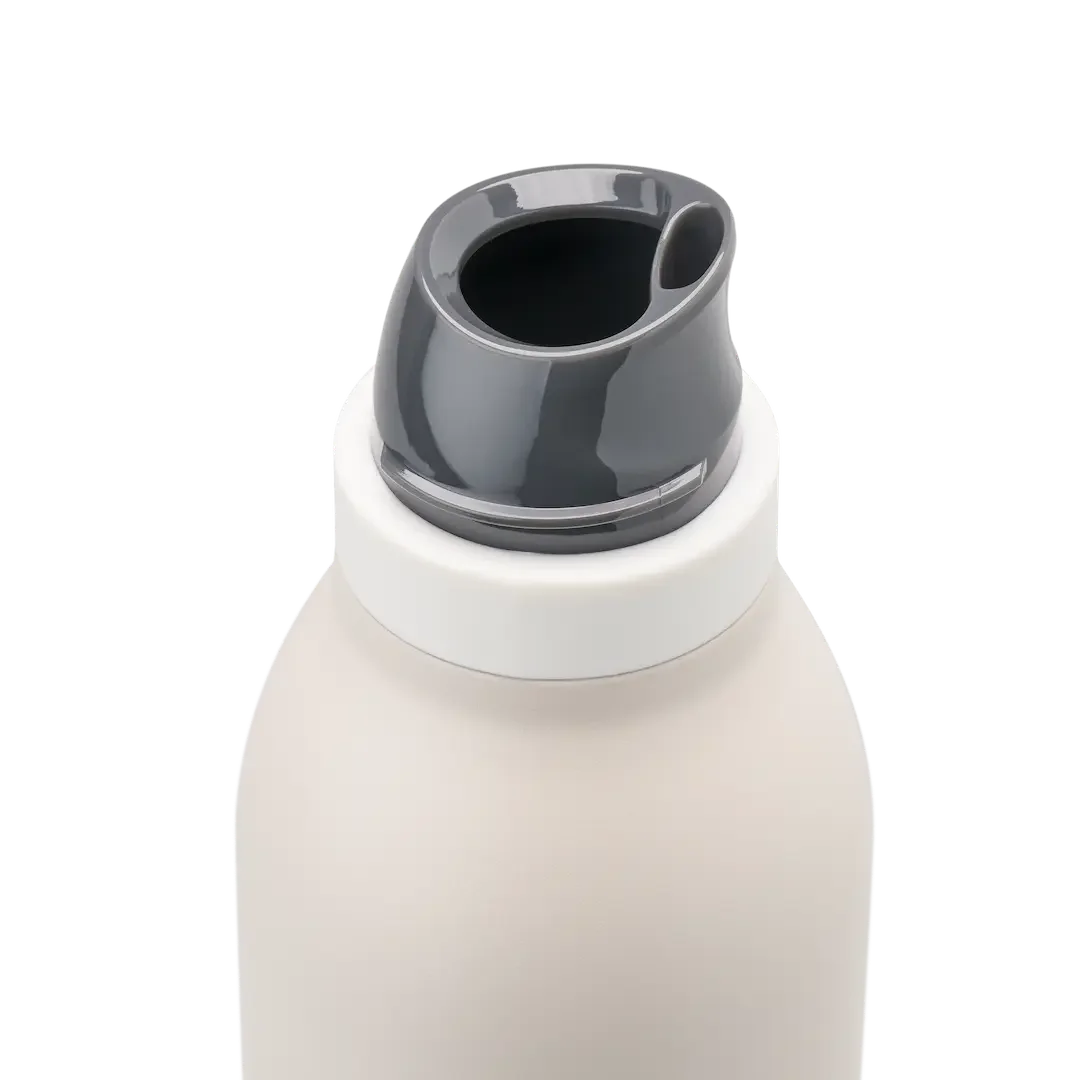 Owala FreeSip Twist in Cream, off-white insulated stainless steel body with twist cap removed showing dark gray FreeSip spout and white twist cap accent band
