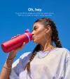 Girl drinking from a red 24oz Owala FreeSip water bottle, highlighting its stylish and functional design.