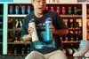 One man holding two Owala freeSips