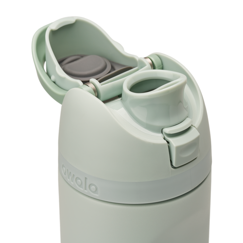 Owala FreeSip 24oz in Summer Paradise, lid detail with flip cap open exposing the FreeSip spout, mint green flip cap and lid with gray silicone straw visible