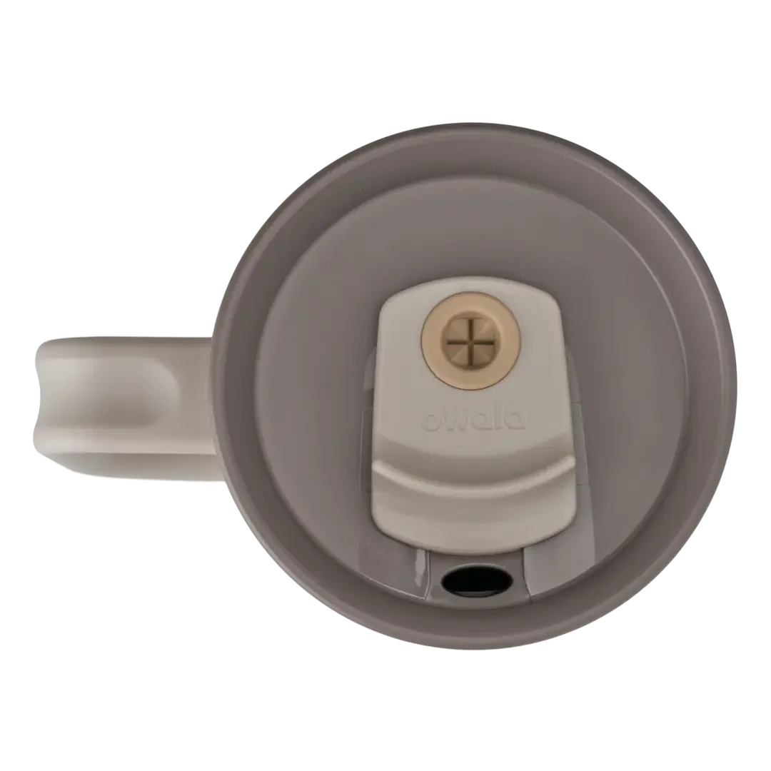 Owala 40oz Tumbler lid detail, top-down view of warm taupe lid with off-white cream straw slider and copper straw hole, and pale gray side handle