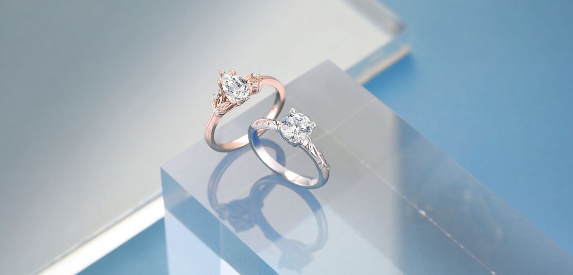 White and yellow gold diamond wedding bands styled on lace fabric, showcasing elegant bridal ring designs by Wedding Bands & Co. in Chicago