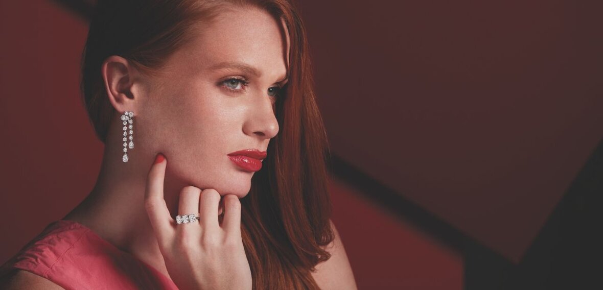 White and yellow gold diamond wedding bands styled on lace fabric, showcasing elegant bridal ring designs by Wedding Bands & Co. in Chicago